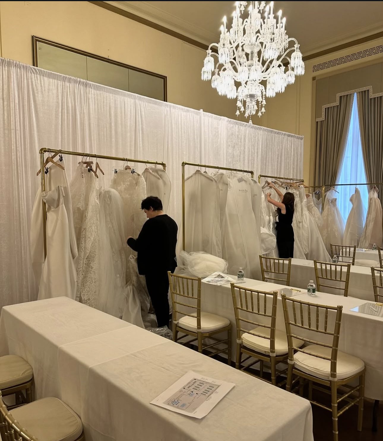 White pipe and drape setup for wedding or formal event
